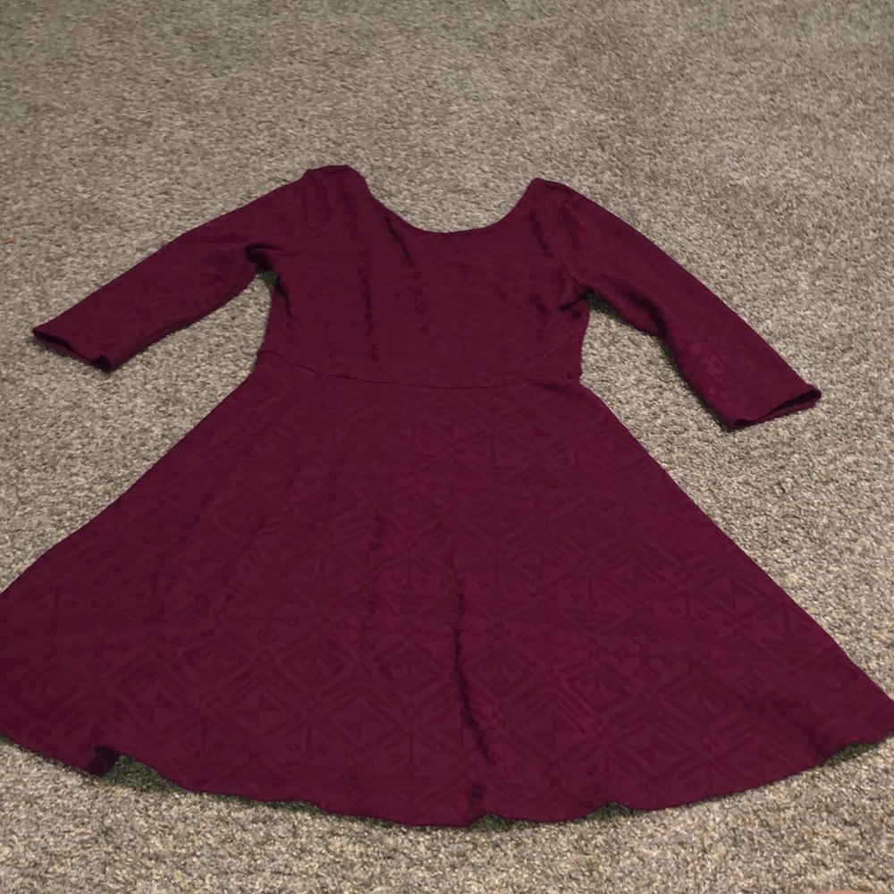 Francesca’s detailed red kitted dress